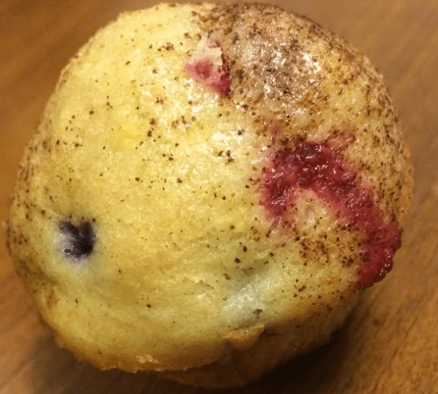 berry muffin on wood table