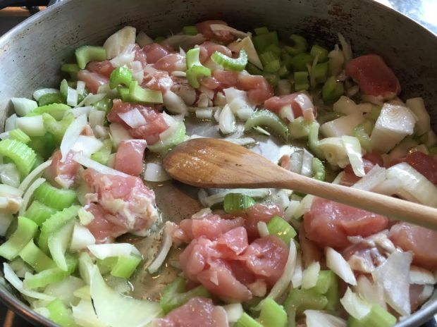 cauliflower couscous-with onions celery and chicken in pan