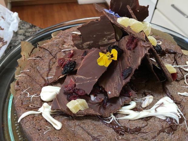 chocoalte bark cut into sections on cake