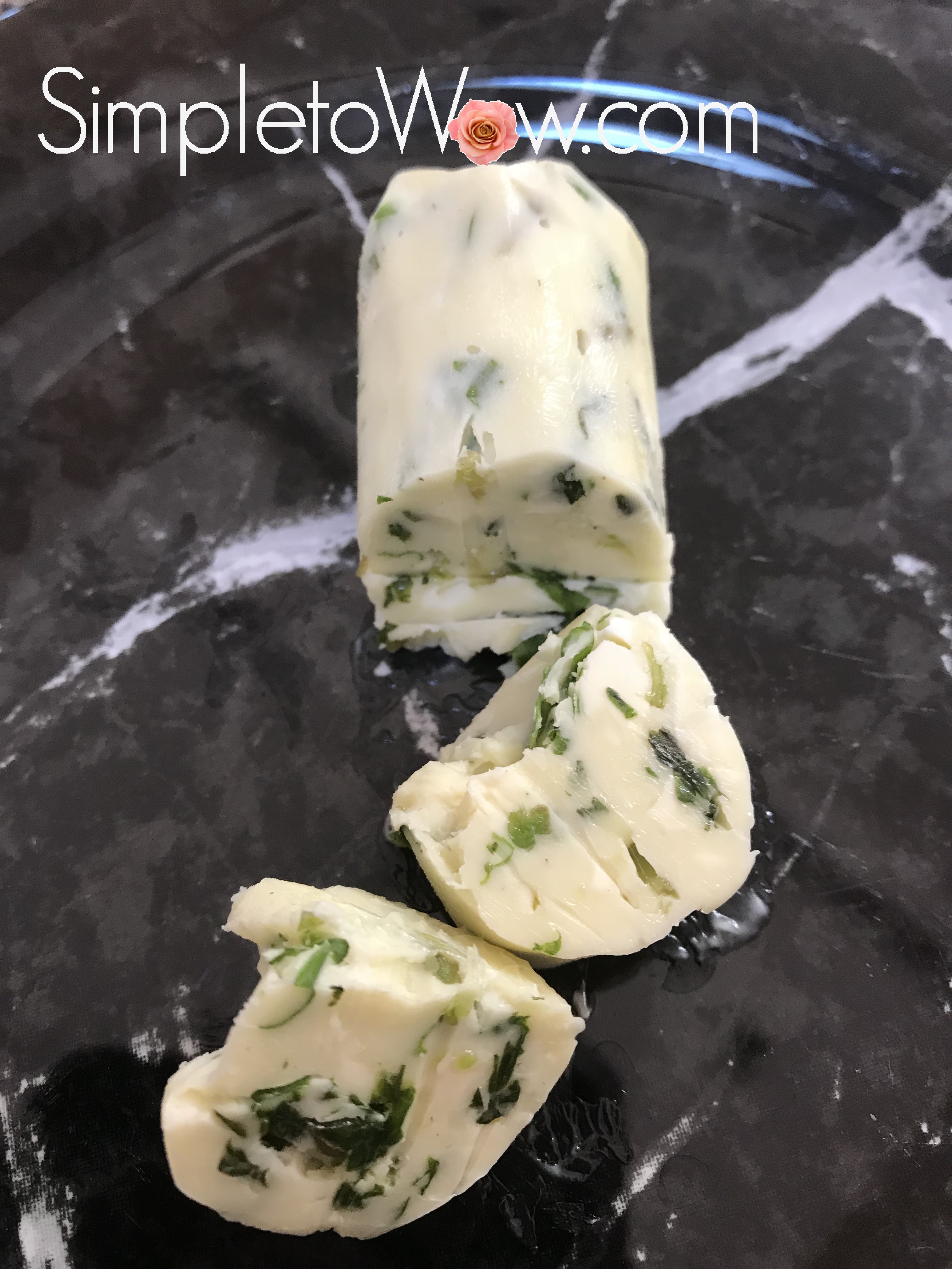 basil butter log cut into pieces.jpg